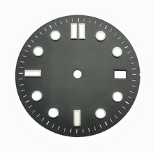 A black and white retro diving dial with baton hour markers.