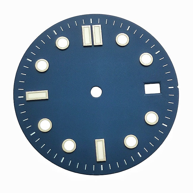 A retro blue and white diving dial with baton hour markers.