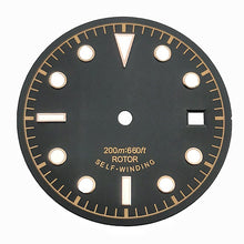 Black and brown vintage-style dive watch dial with baton and dot markers.