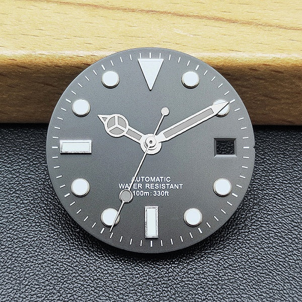 Black and white diving watch dial scene image