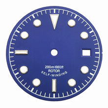 Blue and white vintage-style diving watch dial with baton and dot markers.