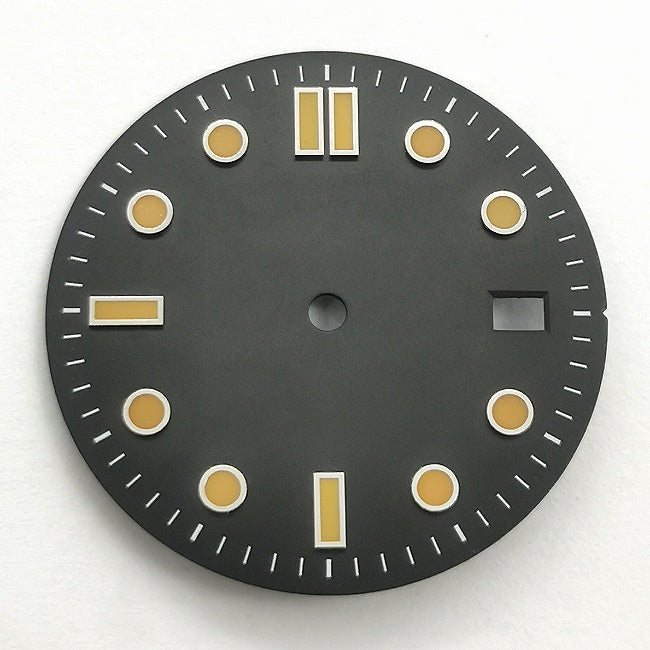 The watch features a retro black and orange diving dial with baton hour markers.