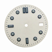 White vintage-style diving dial with baton hour markers.